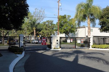 Gate to community entrance l The Knolls Apartment in Orange CA